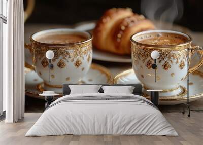 Two steaming cups of coffee with a croissant on a rustic table. Wall mural