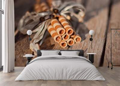 wafer rolls on a wooden board Wall mural