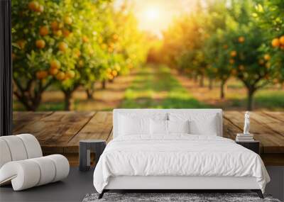 Empty wood table with free space over orange trees, orange field background. For product display montage Wall mural