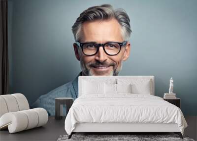 A stylish middle-aged man with a friendly smile wears trendy glasses, looking confident and approachable against a clean, minimalist studio background. Wall mural