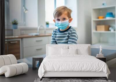 A young child, dressed in casual clothing, sits calmly on an examination table, wearing a blue medical mask to prevent the spread of germs. Wall mural