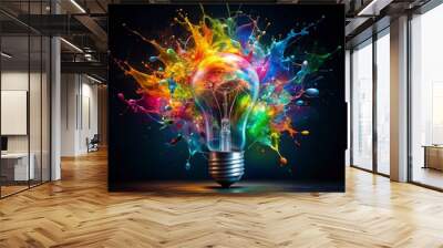 Vibrant colorful paint splashes and swirls around a shattered light bulb on a dark background, symbolizing innovative ideas and creative thinking bursting into reality. Wall mural