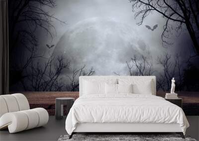 Old wood table and silhouette dead tree at night for Halloween background. Wall mural