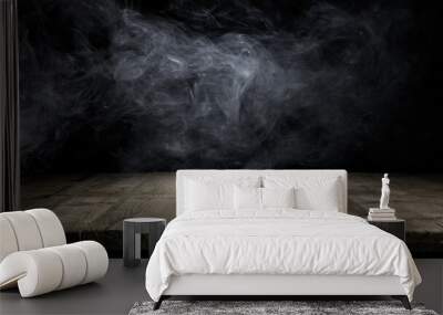 Wood table and smoke on dark background. Wall mural