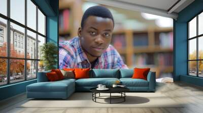 Young Man Reading in Library Wall mural