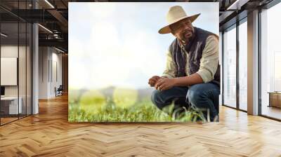 Farmer, black man and mockup for agriculture and sustainability outdoor on an agro farm with bokeh. Person on grass field thinking about farming innovation, growth and ecology in the countryside Wall mural