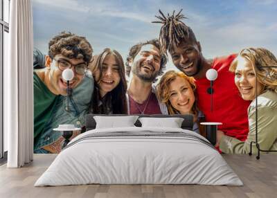 portrait of six people smiling in front of the camera on sunny day, multiracial group of friends having fun moments Wall mural