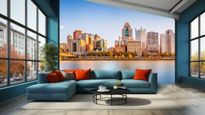 Long exposure of Pittsburgh downtown skyline and Roberto Clemente bridge, on a sunny afternoon, as viewed from North Shore Riverfront Park, across Allegheny River. Wall mural