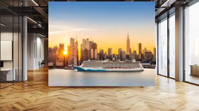 New York City skyline at sunrise, as viewed from Weehawken, along the 42nd street canyon. A large cruise ship sails Hudson river, while sun beams burst between the skyscrapers. Wall mural