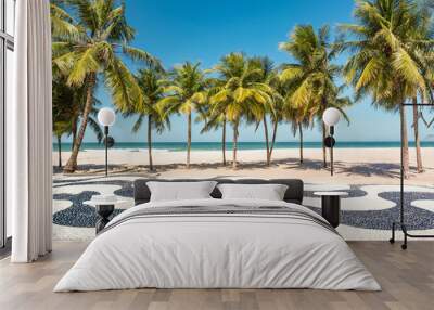 Palm trees and the iconic Copacabana beach mosaic sidewalk, in Rio de Janeiro, Brazil. Wall mural