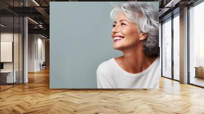 Beautiful gorgeous 50s mid age beautiful elderly senior model woman with grey hair laughing and smiling. Mature old lady close up portrait. Wall mural