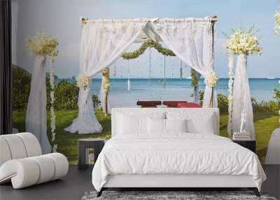 Beautiful beach wedding flower arch setting for wedding venue with panoramic ocean view Wall mural