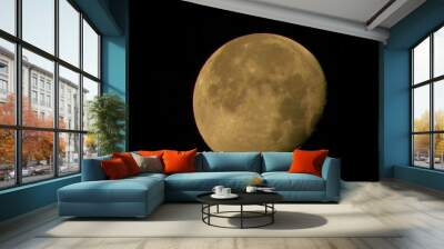 Waning moon in dark night sky Wall mural