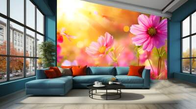 Beautiful cosmos flowers in the field with a sunlight background, with a soft focused and blurred style. A spring meadow full of colorful wildflowers at sunset Wall mural