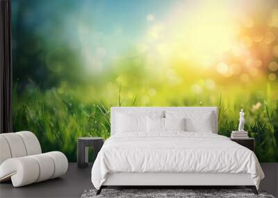 Beautiful spring background with fresh green grass and blue sky. Abstract natural summer landscape. Blurred sunny meadow Wall mural