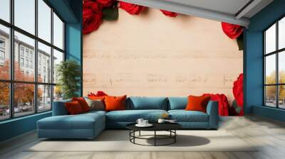 A romantic arrangement of red roses surrounding a blank sheet of paper with faint musical notes, perfect for a love letter or artistic creation. Wall mural