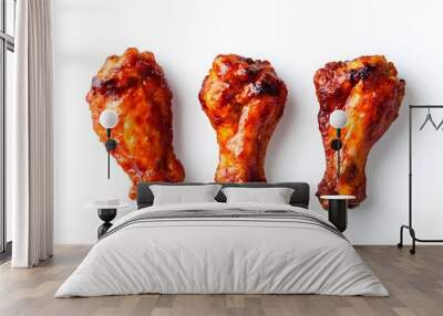 Deliciously cooked chicken drumsticks, perfectly glazed and arranged on a white background, ideal for appetizers or a hearty meal. Wall mural