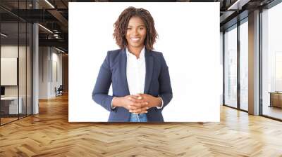 Happy cheerful female consultant looking at camera. Young African American business woman with clasped hands standing isolated over white background, smiling. Happy entrepreneur concept Wall mural