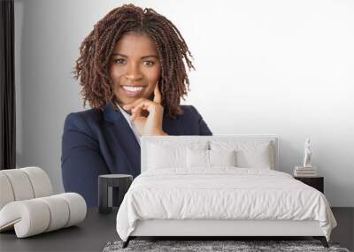 Happy confident beautiful business woman posing in studio. Young African American business lady standing isolated over white background, touching face, smiling at camera. Young entrepreneur concept Wall mural