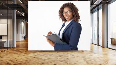 Happy expert checking documents, taking notes in paper, holding pen and folder. Young African American business woman posing isolated over white background. Paperwork concept Wall mural