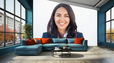 Happy successful businesswoman smiling at camera over white studio background. Closeup of beautiful black haired young Latin woman wearing formal jacket and smiling. Business portrait concept Wall mural