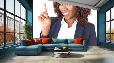 Happy young businesswoman sharing new idea, pointing index finger up. African American business woman standing isolated over white background, looking at camera, smiling. Business idea concept Wall mural