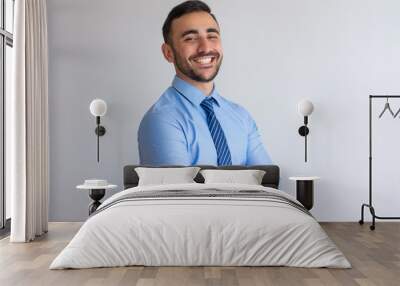 Portrait of joyful professional. Young business man blue shirt and tie crossing arms and smiling at camera. Successful businessman concept Wall mural