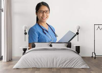 Positive nurse working with medical documents Wall mural