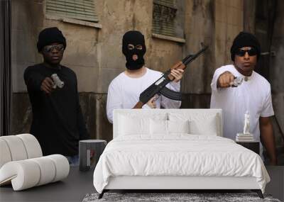 Gang members with guns and rifle on the street Wall mural