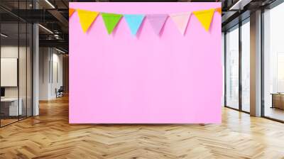 Colorful party flags hanging on pink background, birthday, anniversary, celebrate event, festival greeting card background Wall mural