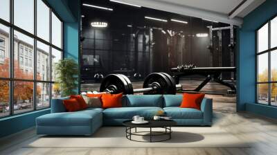 A dark gym interior adorned with black dumbbells. Wall mural