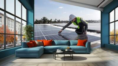 A technician installing the solar panels at roof top of home and home office ,concept of economic energy and cost saving ,own small business Wall mural