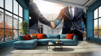 Engineer man handshake with asian business after finishing up meeting, partnership, teamwork, community, connection industriall and investment concept Wall mural