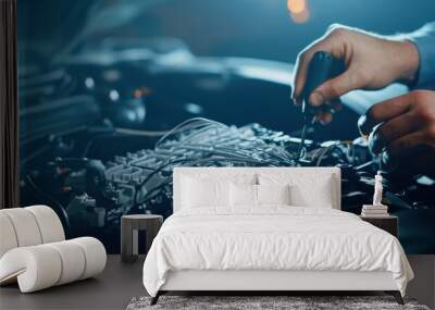 A mechanic's hands working on an automotive engine, demonstrating precision and skill in a well-lit garage environment. Wall mural