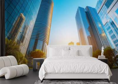 A stunning urban landscape featuring modern skyscrapers and vibrant greenery under a bright sky during sunset. Wall mural