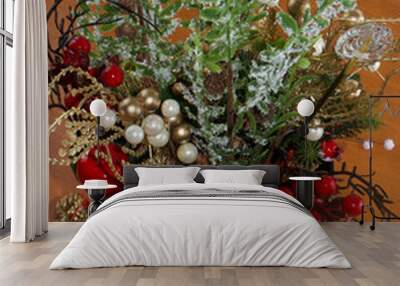 Beautiful ornament with plants, leaves and pine cones with red fruits in selective focus and macro photo. Wall mural