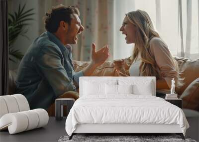 heated argument between a husband and wife. They are seated on a beige sofa in a well-lit room, discussion or disagreement between the couple Wall mural