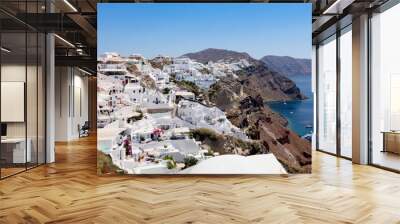 View of the white-walled houses characteristic of Santorini Island nestled along the cliff, Oia, Santorini, Cyclades Islands, Greece Wall mural