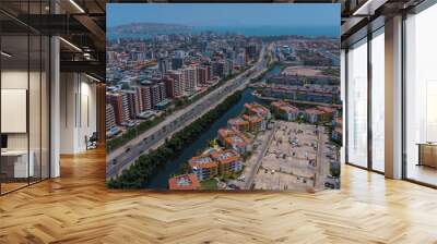 aerial drone shots of the beach city of Lechería, with a residential area of Venice-style stilt houses, you can see houses, editions, canals, houses on the sea, stilt houses, parking lots, swimming po Wall mural