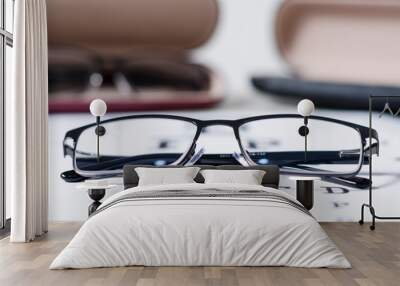 glasses and Eyeglasses on table of check of vision close up - Myopia or hyperopia Wall mural