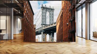 Brooklyn Bridge seen between two beautiful brown buildings at sunset Wall mural