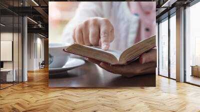 Women reading the Holy Bible,Reading a book. Wall mural