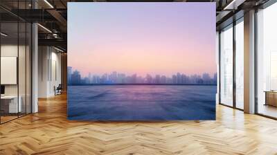 An empty city skyline at sunrise, with the first light of dawn painting the horizon in soft pastel colors, and the promise of a new day dawning over the silent urban landscape, Generative AI Wall mural