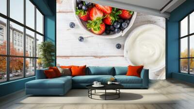 Bowl of natural yogurt with granola and fresh berries Wall mural