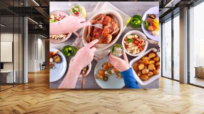 Family dinner. Top view people having dinner together Wall mural