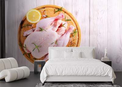 Raw chicken with lemon, rosemary and spices Wall mural