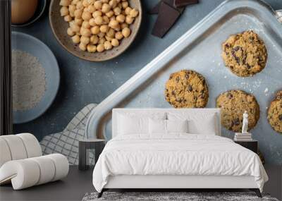 horizontal composition of a baking tray with freshly baked chickpea cookies and dark chocolate chips Wall mural