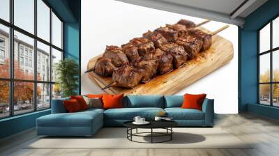 Delicious beef skewers, grilled, wood plate or tray. Isolated white background, Brazilian traditional 