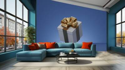 Christmas and New Year present box, white gift box with gold ribbon over blue background. 3d rendering. Wall mural