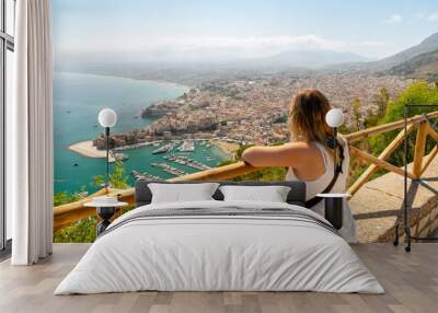 Blond girl on a viewing point near Castellammare del Golfo town on Tyrrhenian coast, Sicily Island, selective focus Wall mural